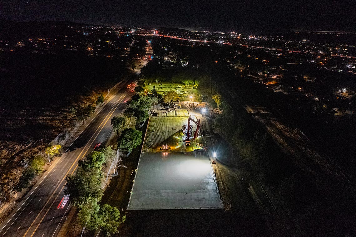 Huff Construction team pouring concrete at 2 AM for Dream Courts sports facility foundation in Pittsburg, CA